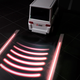 Illustration for article titled Mitsubishi Is Developing Projector Turn Signals To Give Early Warning to Pedestrians and Drivers
